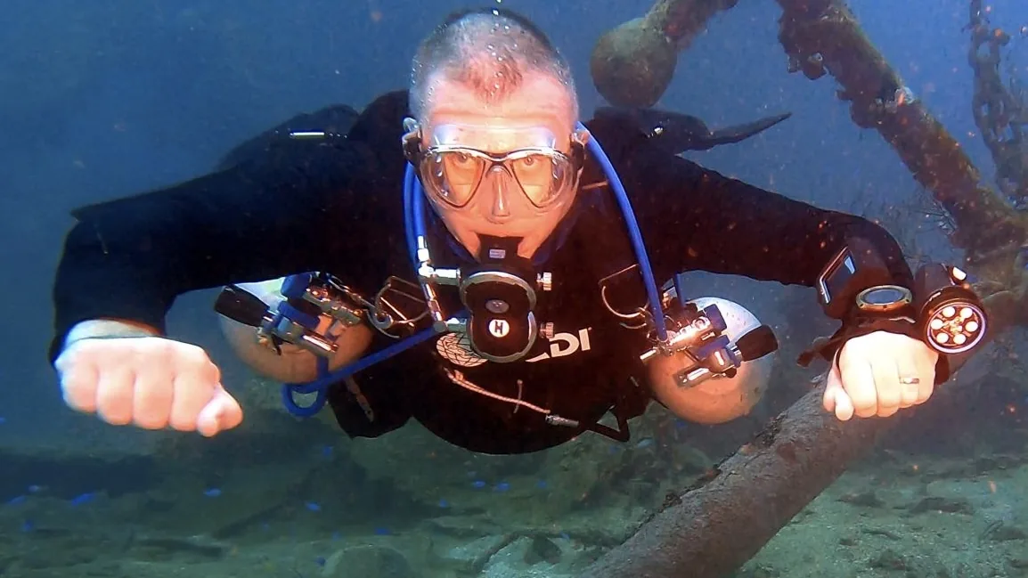 Andrew Grundy underwater in diving equipment