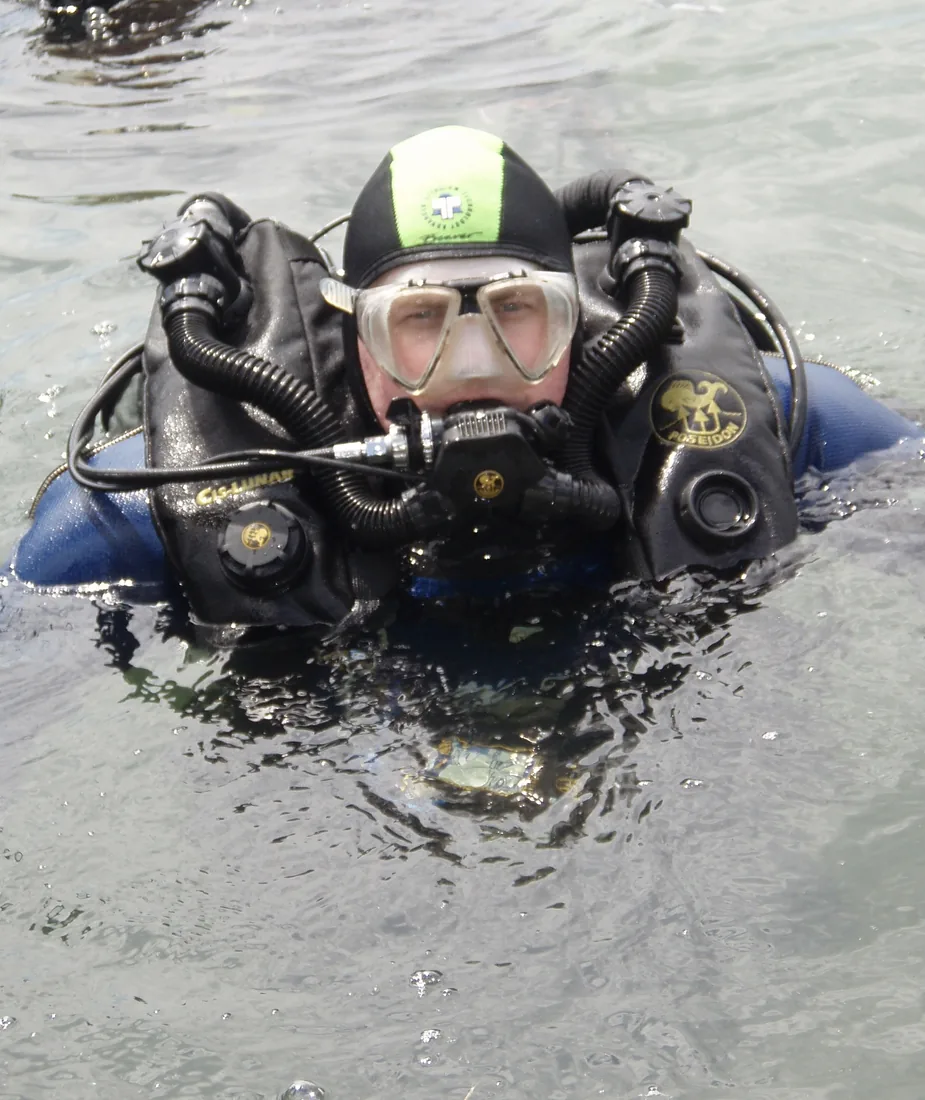 Andrew Grundy in rebreather diving equipment at the surface